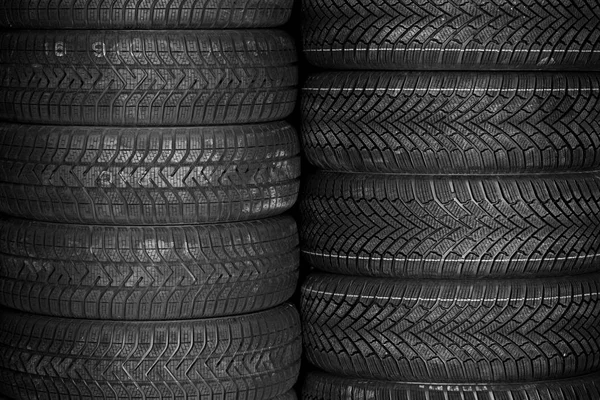 Tires for sale at a tire store - stacks of tires — Stock Photo, Image