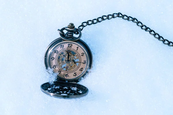 Vintage Old Pocket watch on snowy background — Stock Photo, Image