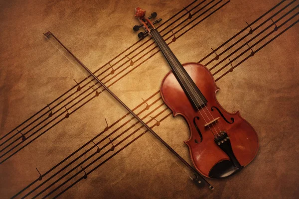 Vintage violin on the sheet music. — Stock Photo, Image
