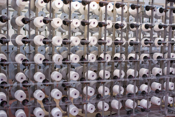 factory housing powered spinning or weaving machinery for the production of yarn