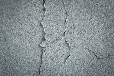 Kırık Beton duvar tasarımı için arka plan olarak gri çimento doku ile kaplı