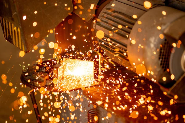 Cutting industrial metal with grinder. Sparks while grinding iron — Stock Photo, Image