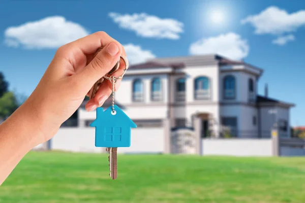 Real estate broker handover the key of residential house for sale