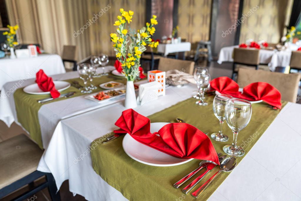 Preparation of table settings in a luxurious A la carte restaurant