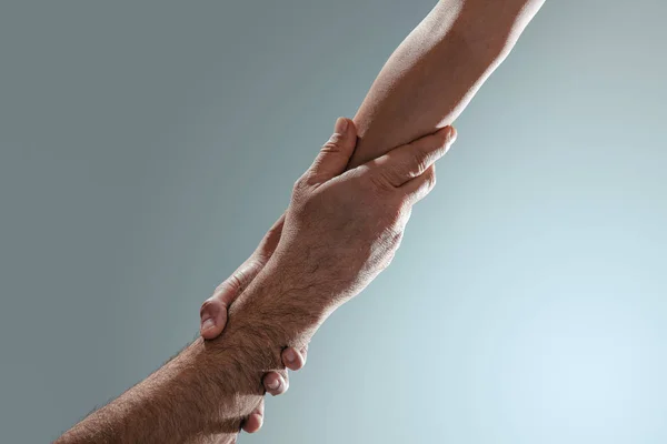 Tho hands holding, help, assist, support und trust concept. — Stockfoto