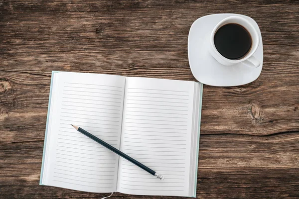 Pencil and an open notebook on white table. Bird eye view, mock-up concept. — 스톡 사진