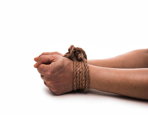 Woman hands knoted by rope or string isolated on white background. Vilonce and abusement woman concept. — Stock Photo, Image