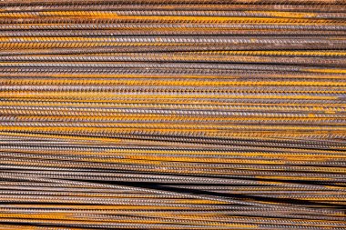 Demir çubuklar, metal çubuk inşaatı ve inşaatı, çelik takviye çubuğu deseni ve dokular için arka plan.