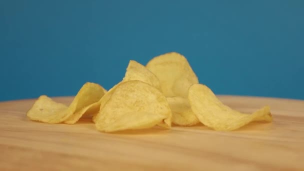 The chips are rotating on a wooden platform — Stock Video