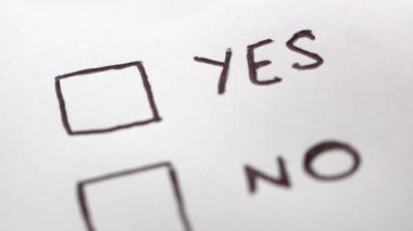 Human hand marking yes on checklist, tick placed on excellent check box. Customer service survey, satisfaction symbol