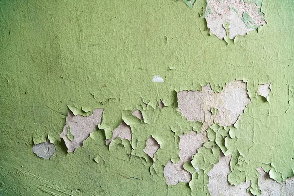 Close up of old stucco cracks on the wall. Weathered paint cracks on plaster. Cracked wall background. Abstract Web Banner