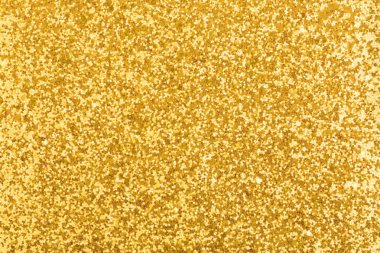 Altın, parlak ve ışıl ışıl arka plan dokusu. Işıklı yeni yıl kartları için.