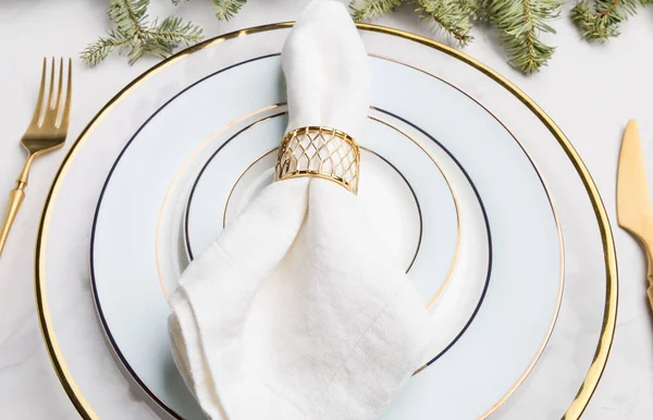 Close up white and gold serving plate for Christmas and New Year\'s Eve