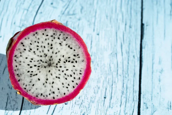 fruit  dragon fruit on a blue wooden table