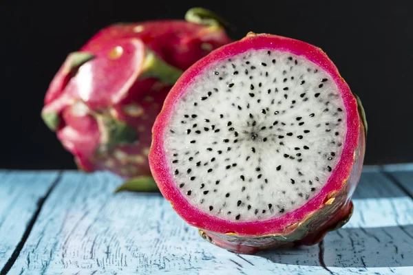 fruit  dragon fruit on a blue wooden table