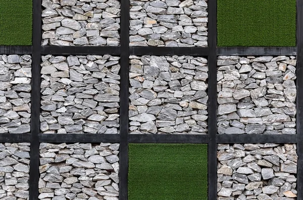 stone walls and artificial grass