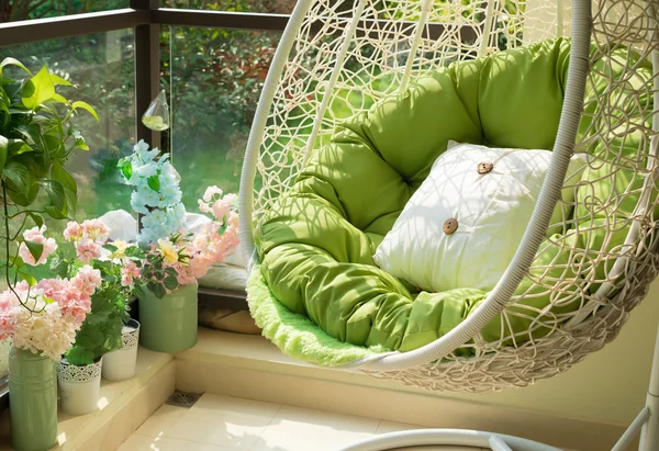Garden swing with mattress and cushion in a balcony in the morning — Stock Photo, Image