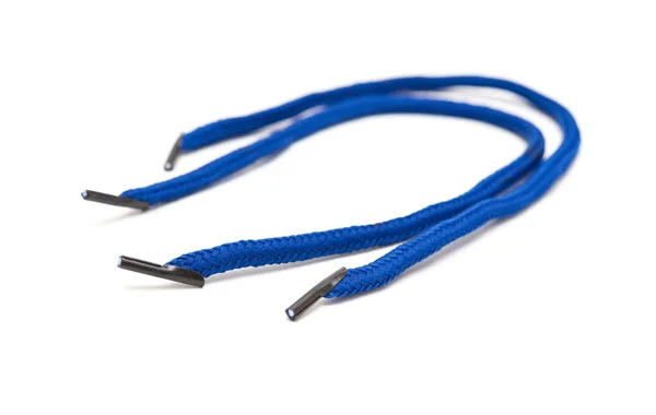 Zakrzywione niebieskie sznurowadła na białym tle — Zdjęcie stockowe