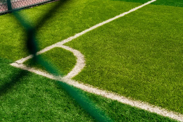 Corner of a soccer field behind the fence — Stock Photo, Image