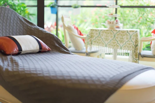 Resting seat with pillow near to a cozy balcony in the morning — Stock Photo, Image