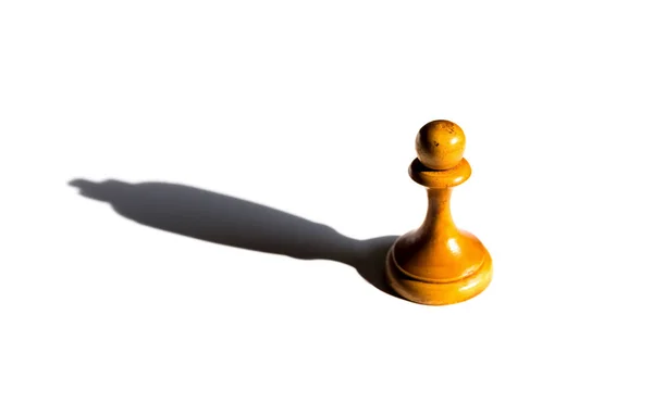 A chess pawn casting a king piece shadow concept of strength and aspirations — Stock Photo, Image