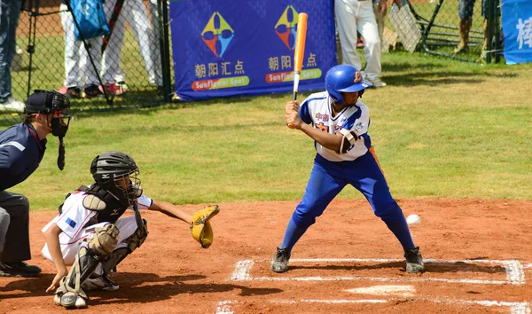 Batter about to miss the ball in a baseball game — Stock Photo, Image