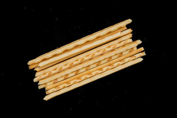 Top view pretzel sticks on a black background — Stock Photo, Image