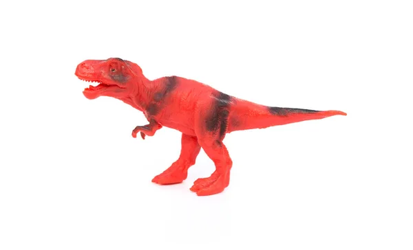 Jouet tyrannosaure rouge et noir sur fond blanc — Photo