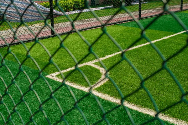 Corner of a soccer field behind the fence — Stock Photo, Image