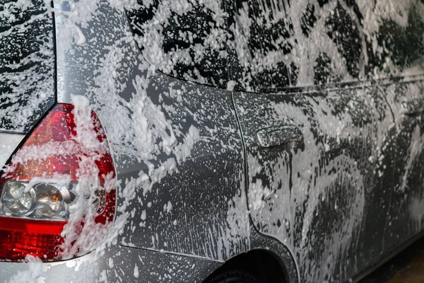 Washing a car with soapy water — Stock Photo, Image