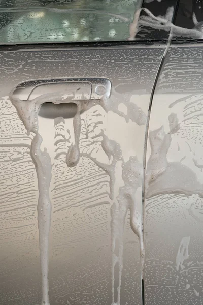 Washing a car with soapy water — Stock Photo, Image