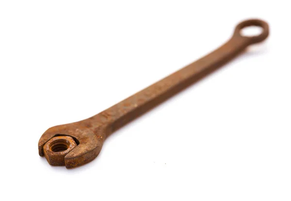 Rusty nut and spanner on a white background — Stock Photo, Image