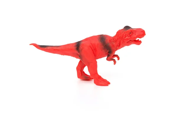 Jouet tyrannosaure rouge et noir sur fond blanc — Photo