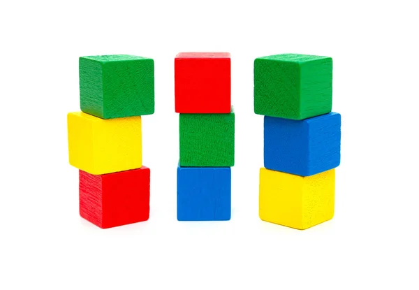 Colorful wooden toy blocks on a white background Stock Picture