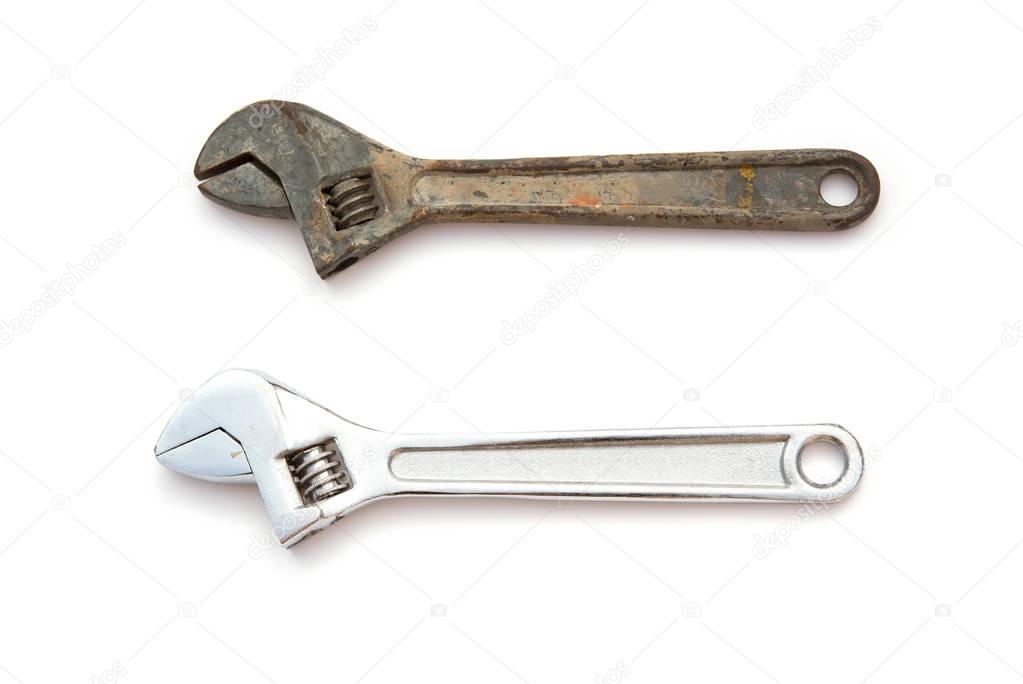 a rusty and a good wrenches on white background