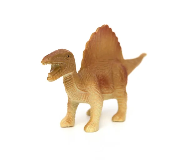 Brun spinosaurus leksak på en vit bakgrund — Stockfoto