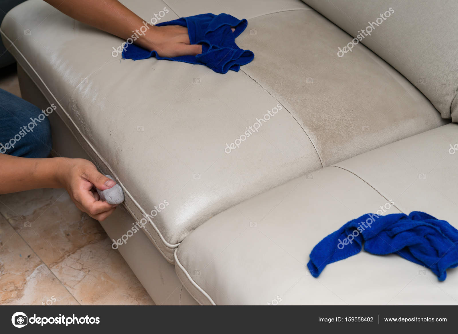 Cleaning Leather Sofa With Sponge And Towel At Home Stock