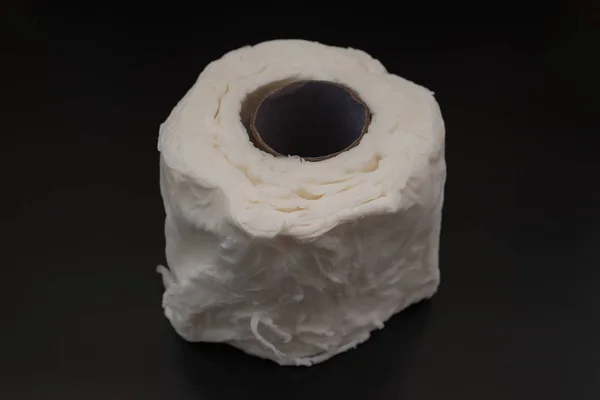 Wet tissue roll on a black background — Stock Photo, Image