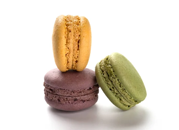 Studio shoot of colorful macaroons stack up on a white background — Stock Photo, Image