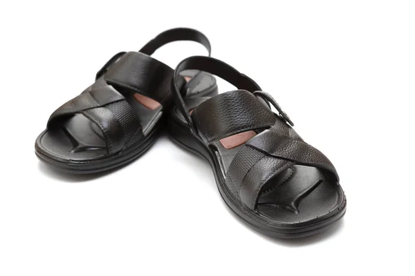 Paar schwarze Freizeit-Sandalen auf weißem Hintergrund — Stockfoto