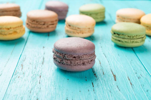 Studio shoot of colorful macaroons on a blue wood background — Stock Photo, Image