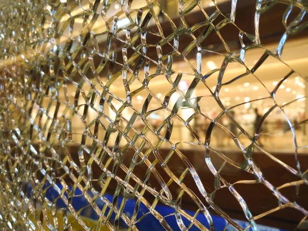 broken glass barrier in a morden shopping mall selective focus