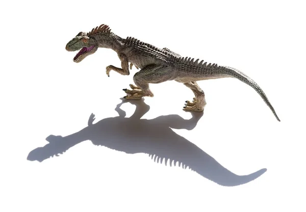 Allosaurus toy on a white background with shadow — Stock Photo, Image