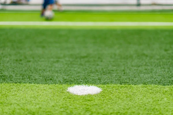 Soccer field with kids playing in the far end selective focus — Stock Photo, Image