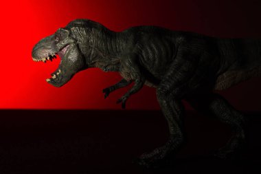 Tyrannosaurus ile baş ve arka plan üzerinde kırmızı ışık spot ışık