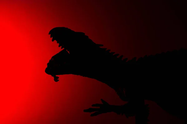 Shadow Carcharodontosaurus Biting Human Body Red Light Dark — Stock Photo, Image