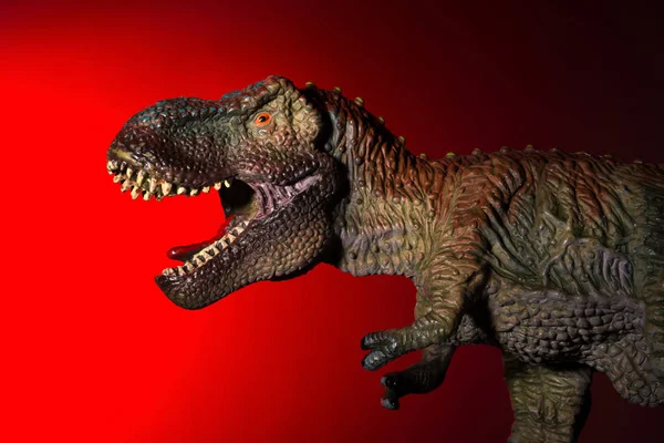 Tyrannosaurus Spot Light Head Red Light Background — Stock Photo, Image
