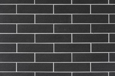 Arkaplan ve doku olarak kare biçiminde siyah tuğlalı tuğla ve beyaz dolgu