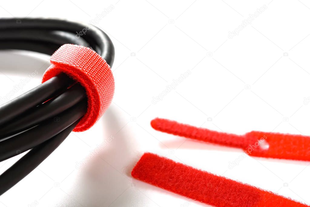 red velcro cable tie and cable on white