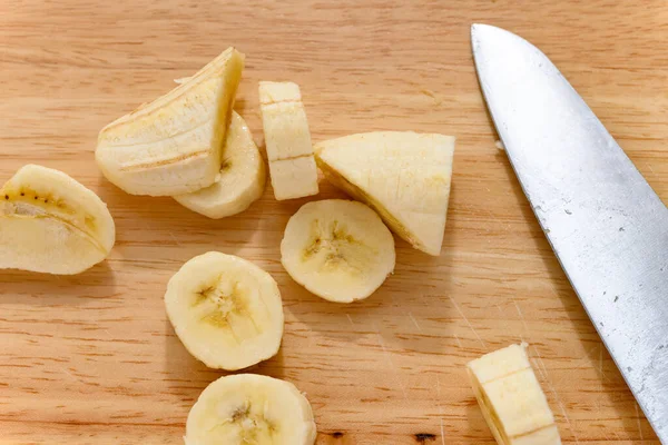 fresh banana slices with a knife